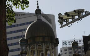 Security cameras are seen on a street in Urumqi, capital of China's Xinjiang region on July 2, 2010.