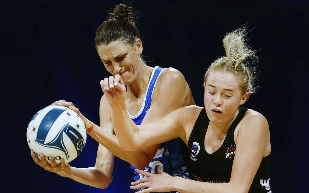Anna Harrison and Monica Falkner battle for the ball during the Mystics win.