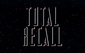 The words Total Recall on a night sky background from publicity for the 1990 movie