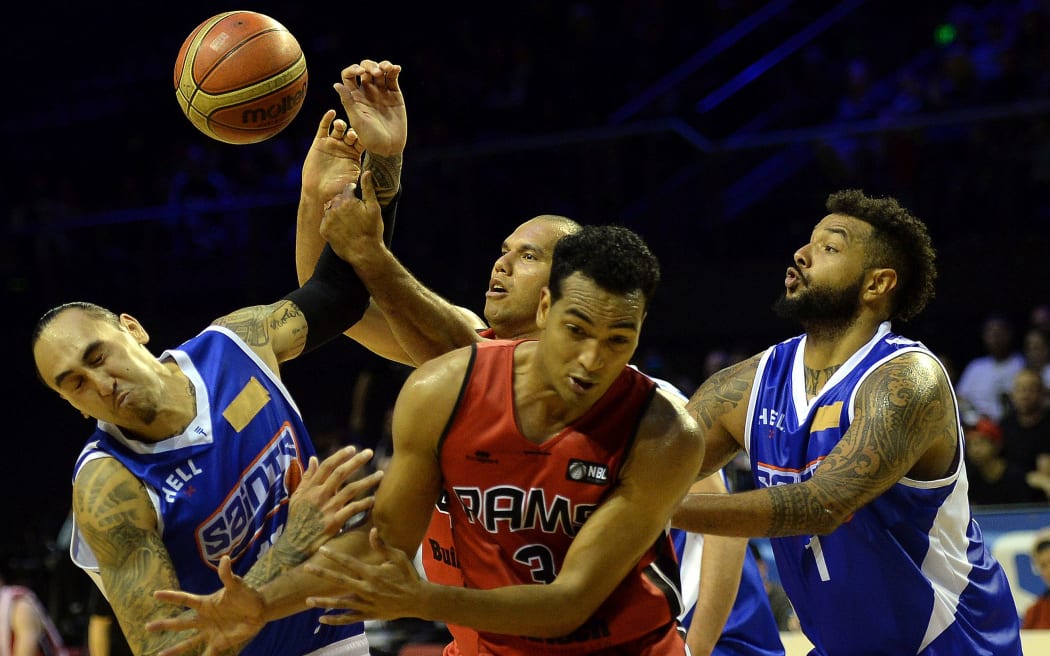 Wellington Saints' players Leon Henry (l) and BJ Anthony (r) with tape over their NBL logos.