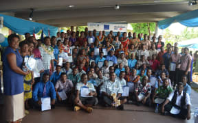 Fiji sugar industry workers pose for a group photo after their graduation in Nadi.