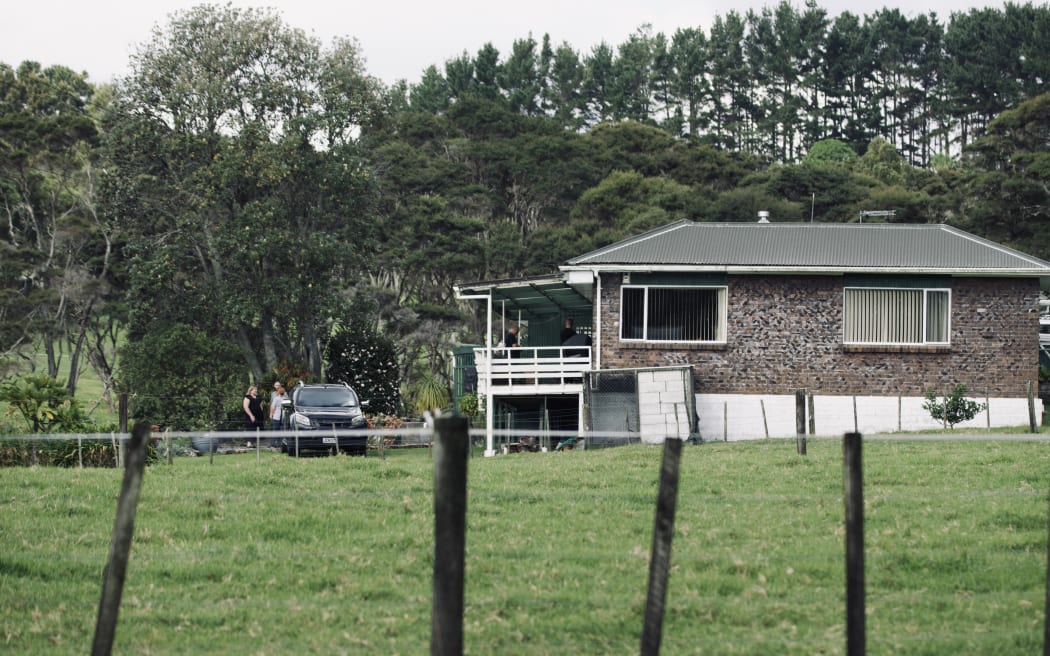Police cars at a property on Anzac Valley Rd in rural Waitākere, west Auckland, on 18 April 2024.