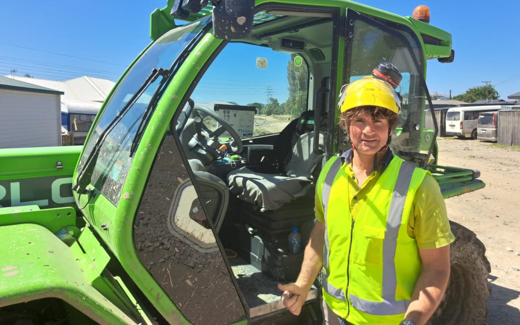 Rick Kirkland with his green Merlo Telehandler.