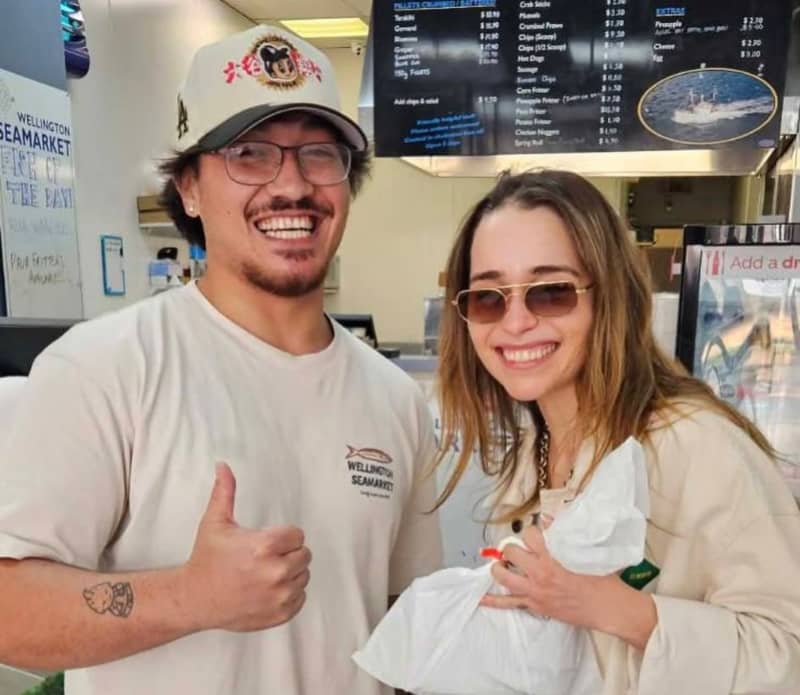 British actress Emilia Clarke at the Wellington Seafood Market in Lambton Quay, with T.