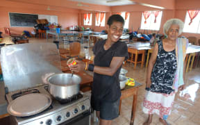 It's all smiles at the evacuation centre in Rakiraki, Fiji, preparing corned beef and noodles