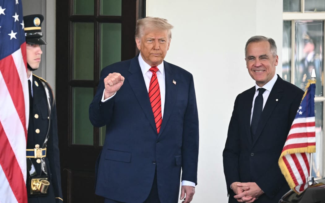 US President Donald Trump greets Canadian Prime Minister Mark Carney as he arrives at the White House in Washington, DC, on May 6, 2025. (Photo by Mandel NGAN / AFP)