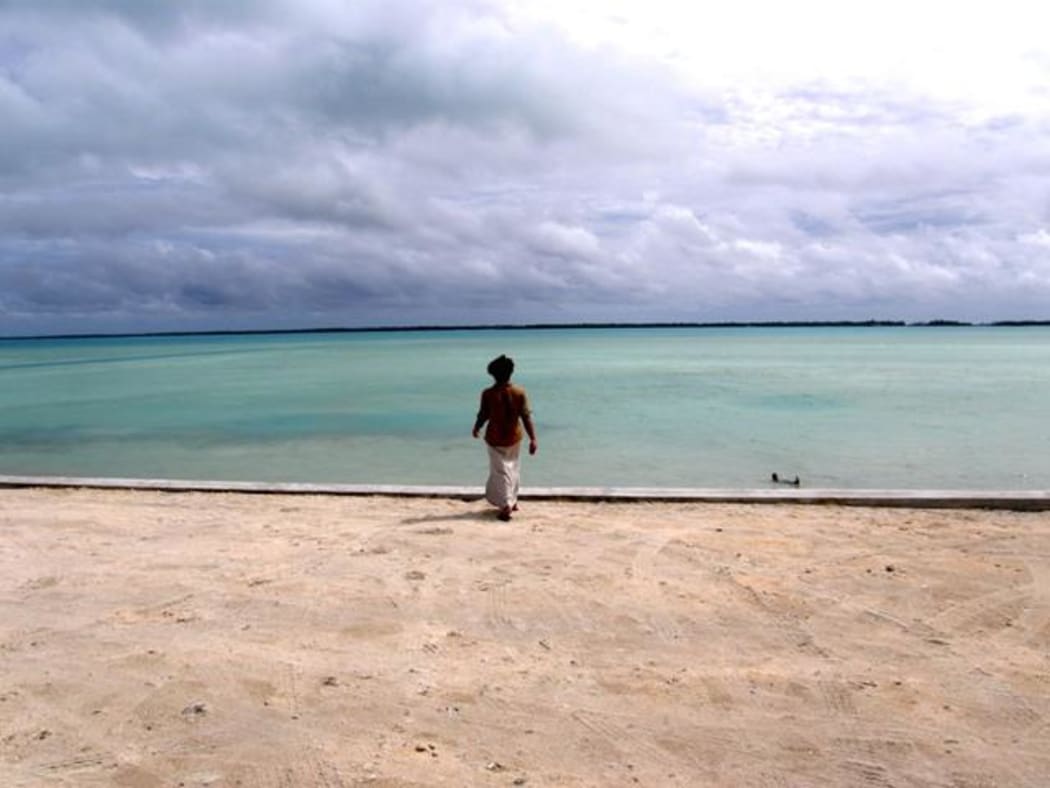 Kiribati - figure at shoreline