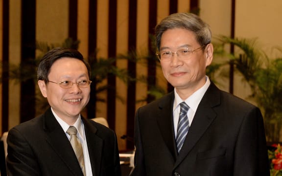 Taiwan's Wang Yu-chi, left, and Zhang Zhijun from China.