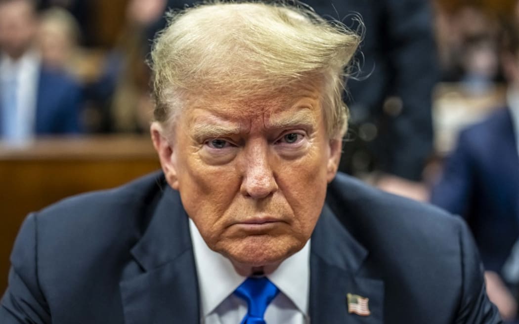 Former US President and Republican presidential candidate Donald Trump attends his criminal trial at Manhattan Criminal Court in New York City, on May 30, 2024. Jurors return Thursday to a second day of deliberations in Donald Trump's criminal trial, leaving the Republican presidential candidate and the country waiting for a decision that could upend November's election. (Photo by Mark Peterson / POOL / AFP)