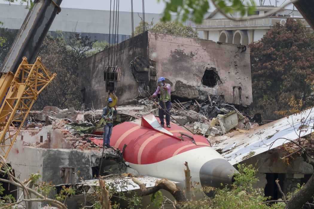 Members of Indian Army's engineering arm prepare to remove the wreckage of an Air India aircraft, bound for London's Gatwick Airport, which crashed during take-off from an airport in Ahmedabad, India June 14, 2025. (Photo by Basit Zargar / Middle East Images via AFP)