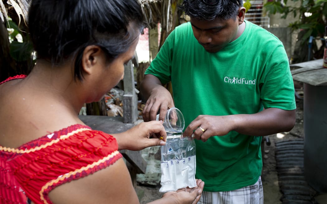 David Kakiakia on a household visit to do water testing in Kiribati.