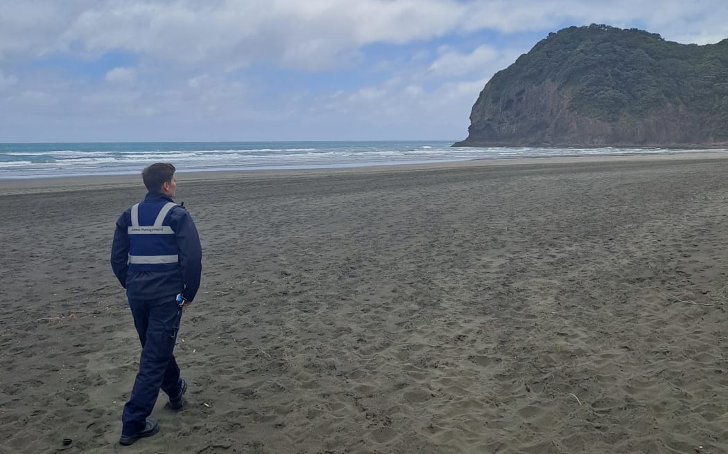 Fletcher Munsterman patrolling Piha Beach as a beach dog warden.