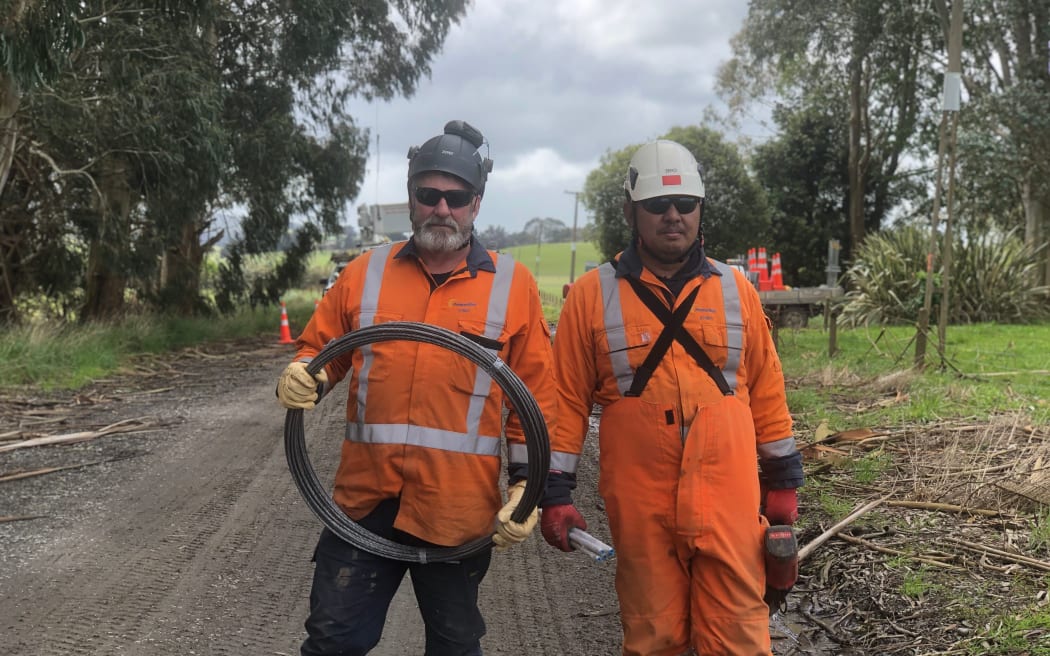 Fred Allan and Josidy Tallada are some of the workers improving the outlook for those still without power in Southland.