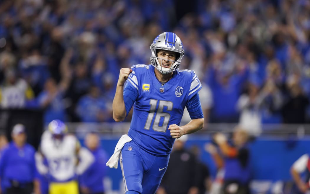 Jared Goff #16 of the Detroit Lions celebrates after the team scored a touchdown during an NFL wild-card playoff football game against the Los Angeles Rams at Ford Field.
