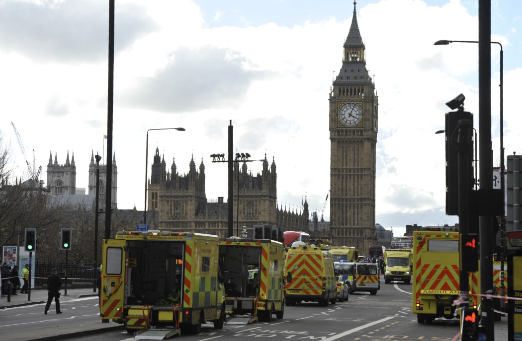 Members of the emergency services work to help victms on Westminster Bridge.