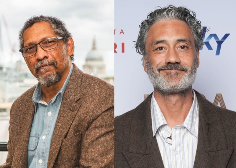 Percival Everette and Taika Waititi appear in separate photos, both have grey hair and beards and brown suit jackets.