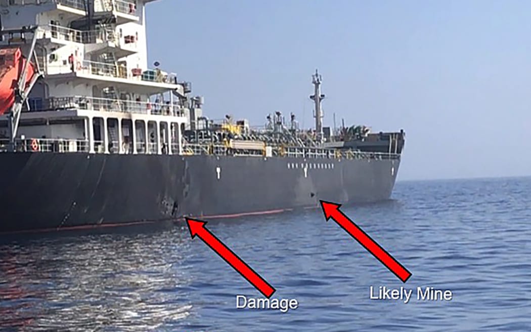 This handout powerpoint slide provided by US Central Command damage shows an explosion, left, and a likely limpet mine can be seen on the hull of the civilian vessel M/V Kokuka Courageous.