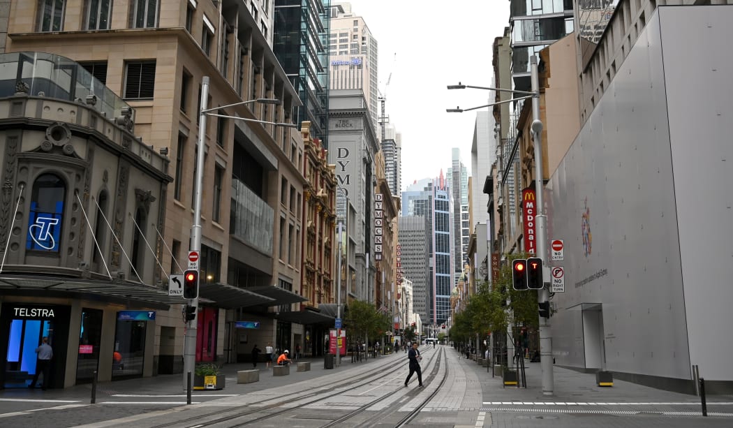 Near-deserted streets are seen in the central business district as people stay home due to the COVID-19 novel coronavirus outbreak in Sydney on March 30, 2020. - Australia has recorded almost 4,000 cases of the coronavirus, COVID-19, with the death toll rising to 17 as of March 30.