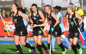 Players celebrates Olivia Merry's goal.