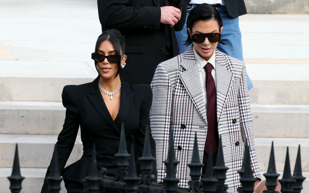 US celebrity Kim Kardashian (L) leaves the courthouse with her mother Kris Jenner (R) after testifying before the Assize Court for the trial over the 2016 robbery that saw her relieved of millions of dollars' worth of jewellery at gunpoint in Paris, on May 13, 2025. The trial of this sensational nine million euro jewellery robbery opened in Paris on April 28, 2025. (Photo by Alain JOCARD / AFP)