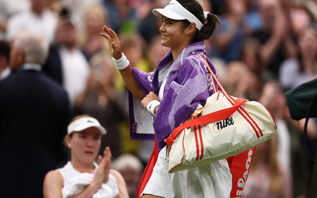 Britain's Emma Raducanu leaves the court after losing against New Zealand's Lulu Sun during their women's singles fourth round tennis match on the seventh day of the 2024 Wimbledon Championships at The All England Lawn Tennis and Croquet Club in Wimbledon, southwest London, on July 7, 2024. Sun won the match 6-2, 5-7, 6-2. (Photo by HENRY NICHOLLS / AFP) / RESTRICTED TO EDITORIAL USE