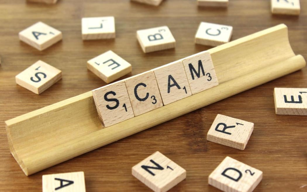 Scam spelled in scrabble