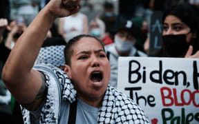 Thousands of protesters and activists shut down a street as they voice anger at Israel and support of Palestinians in New York City.