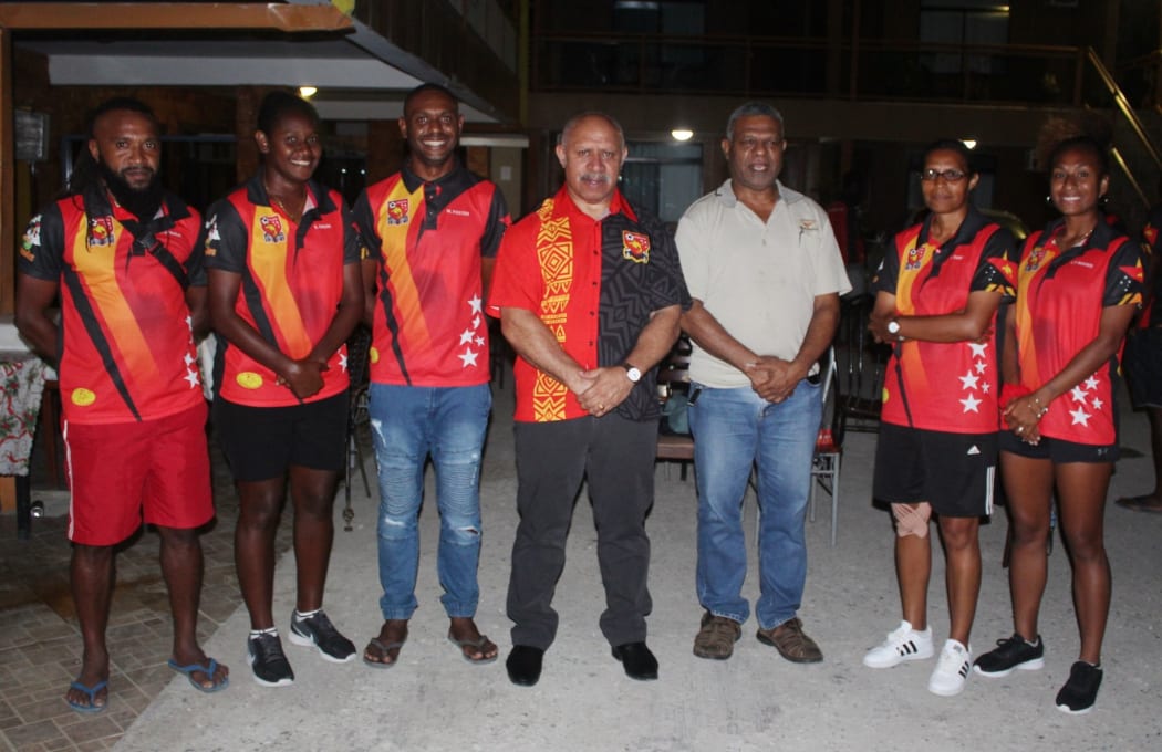 PNG Football Association General Secretary Dimirit Mileng (3R) with President John Kapi Natto and members of the men's and women's national teams.