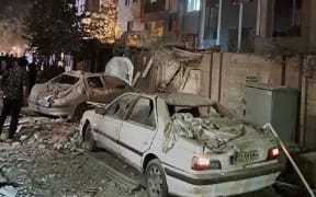 This handout photo released by Iran's Revolutionary Guard Corps (IRGC) official Sepah News Telegram channel on June 13, 2025 reportedly shows a building in Tehran hit in an Israeli strike on the Iranian capital early in the morning. Israeli Prime Minister Benjamin Netanyahu said in a video statement in the early hours of June 13 that Israel carried out strikes on Iran and the military operation against the Islamic republic would "continue for as many days as it takes". (Photo by SEPAH NEWS / AFP) / RESTRICTED TO EDITORIAL USE - MANDATORY CREDIT "AFP PHOTO / SEPAH NEWS " - NO MARKETING NO ADVERTISING CAMPAIGNS