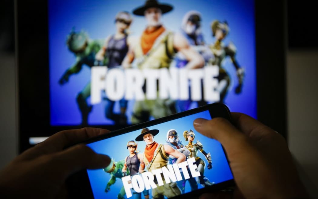 A man plays Fortnite game on smartphone in Ankara, Turkey on November 26, 2018. 
 Metin Aktas / Anadolu Agency