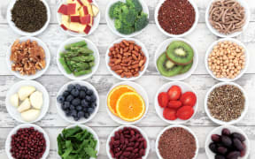 21539836 - large super food selection in white porcelain dishes over distressed white wooden background