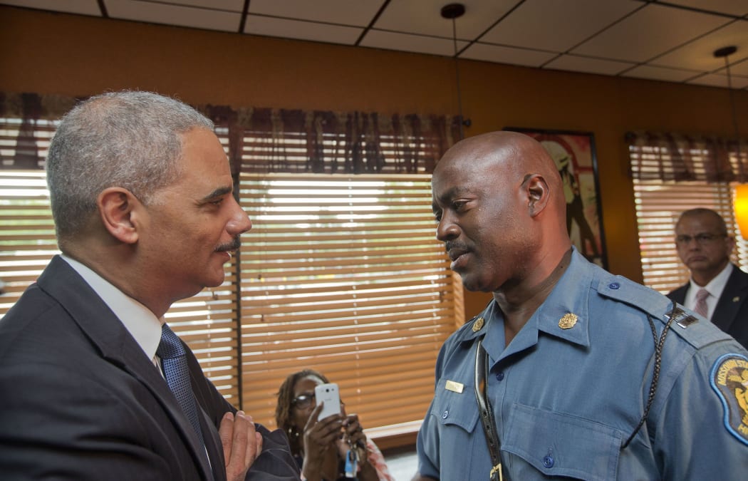 US Attorney General Eric Holder,(left) with Captain Ron Johnson of the Missouri State Patrol.