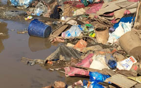 Rubbish pushed into piles in a settlement near Nadi during the cyclone clean-up
