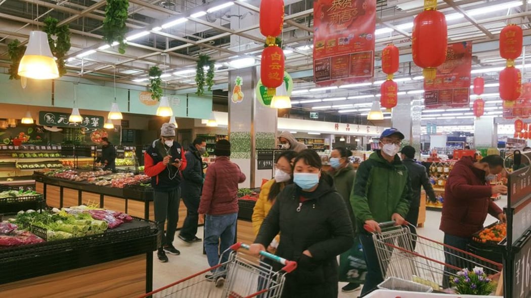 Locals at a supermarket near the Wuhan University.