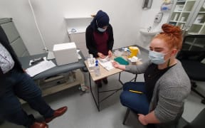 RNZ reporter Ella Stewart's blood is taken to be tested to check how protected she is from Covid-19