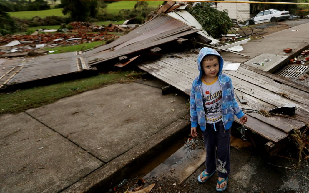 Locals survey the damage and destruction caused by flooding in Dungog in the NSW Hunter region. April 22, 2015.