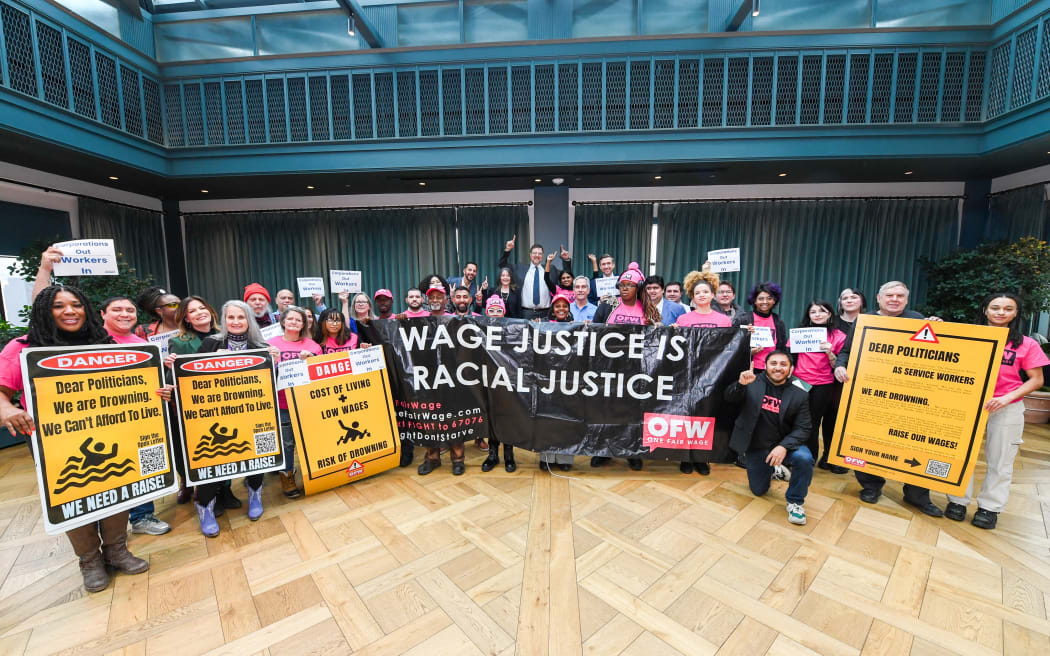 DETROIT, MICHIGAN - JANUARY 16: One Fair Wage supporters along with DNC Chair Candidates Ken Martin, Marianne Williamson, and Ben Wikler pose for a photo at the "Win With Workers" Rally and Press Conference at the DNC Midwestern Candidate Forum on January 16, 2025 in Detroit, Michigan.   Aaron J. Thornton/Getty Images for One Fair Wage/AFP (Photo by Aaron J. Thornton / GETTY IMAGES NORTH AMERICA / Getty Images via AFP)