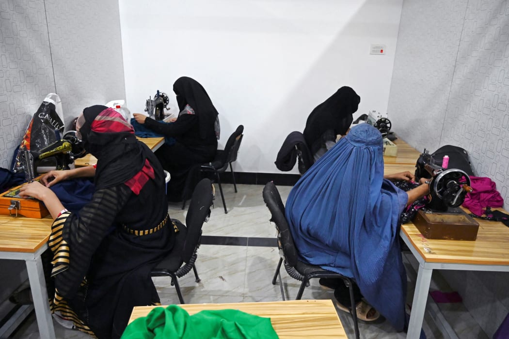 Women work in a tailor workshop at the Khadija Kubra Women's Association for Culture in Kandahar in September 2020,