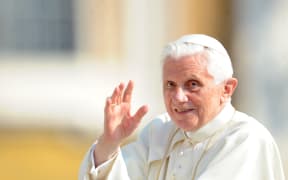 (FILES) In this file photo taken on September 28, 2011 Pope Benedict XVI waves to faithful as he arrives for his weekly general audience at St Peter's square at The Vatican. - Pope Emeritus Benedict XVI, a German theologian whose 2013 resignation took the world by surprise, died on December 31, 2022, at age of 95, the Vatican announced. (Photo by Tiziana FABI / AFP)