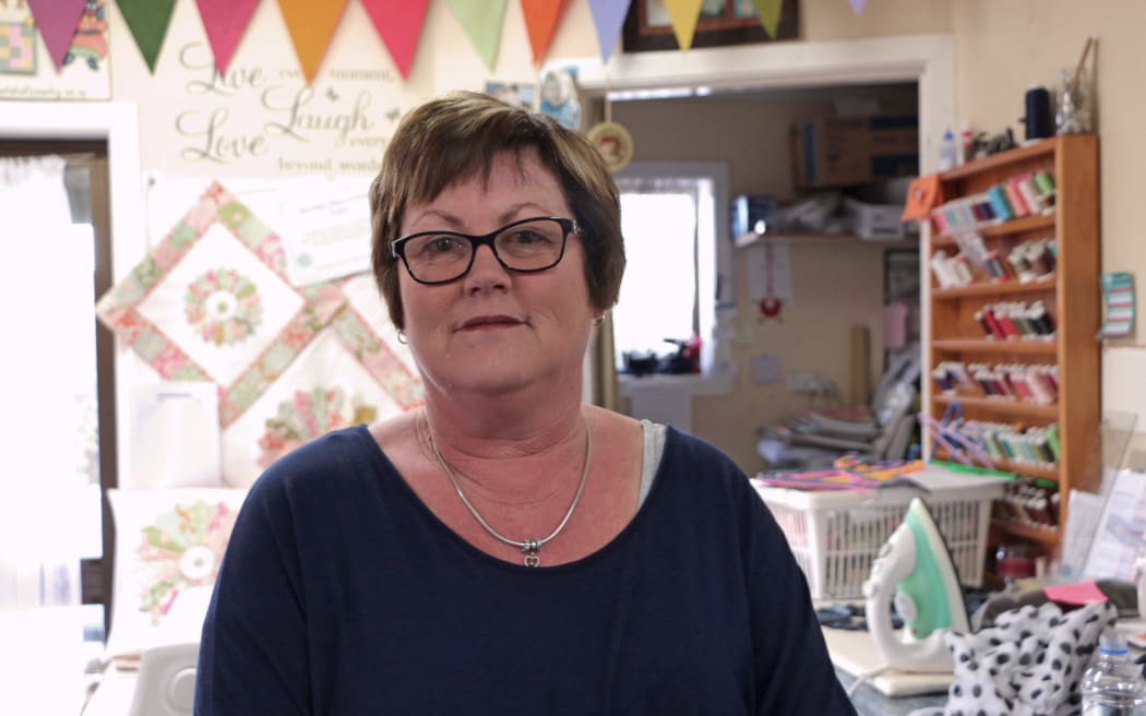 Portrait of a woman in her craft shop