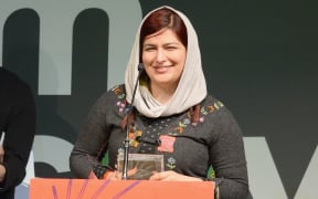 Rokhsareh Ghaemmaghami accepts an award for the film 'Sonita' at the Sundance Film Festival Awards 2016.