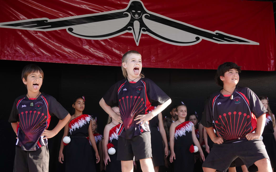 Boys from Opua School finish their set with a pūkana.
