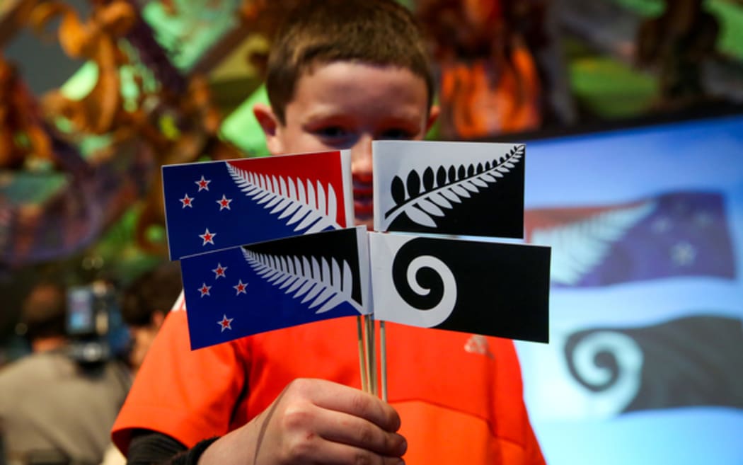 Naenae Primary School student Sam Cooper, 10, with the final four flag designs.