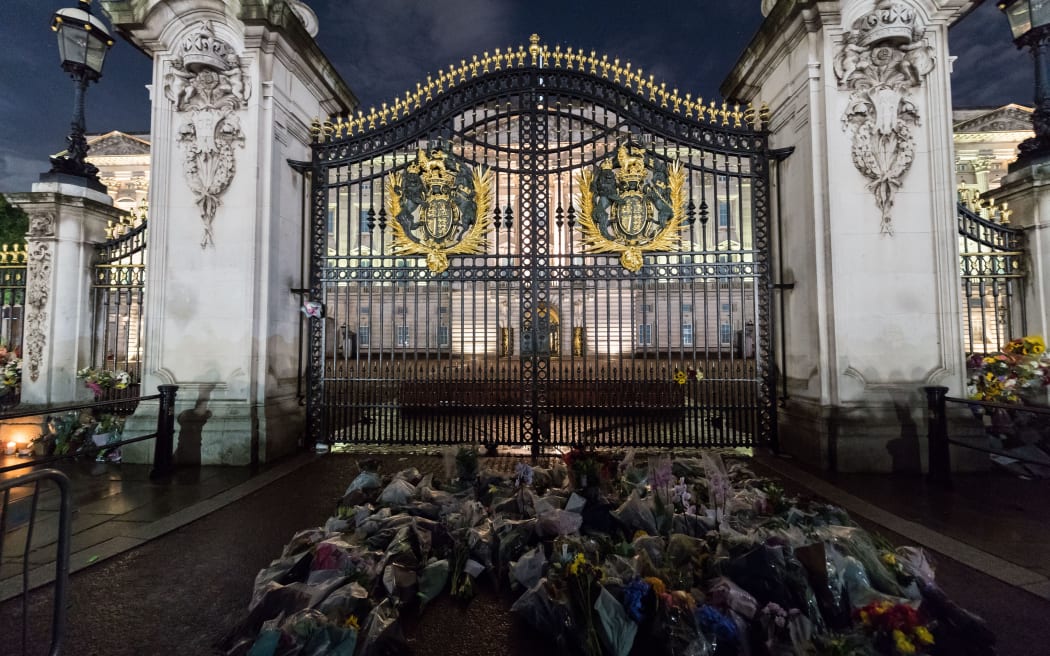 The first floral tributes placed on the gates of Buckingham Palace by members of the public following the announcement of the death of Queen Elizabeth II.