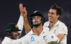 Colin de Grandhomme reacts as he heads back to the dresssing room.