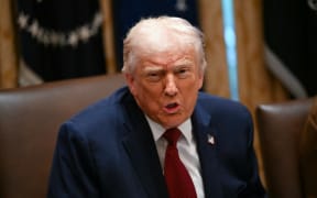 US President Donald Trump speaks during a roundtable event to discuss aid for farmers, in the Cabinet Room of the White House in Washington, DC, on December 8, 2025.