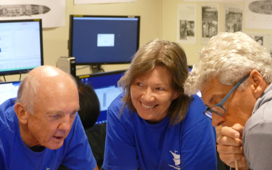 Andrea Williams (centre) who lost both her grandfather and her great uncle when the Montevideo Maru sank, with members of the Silentworld Foundation team.