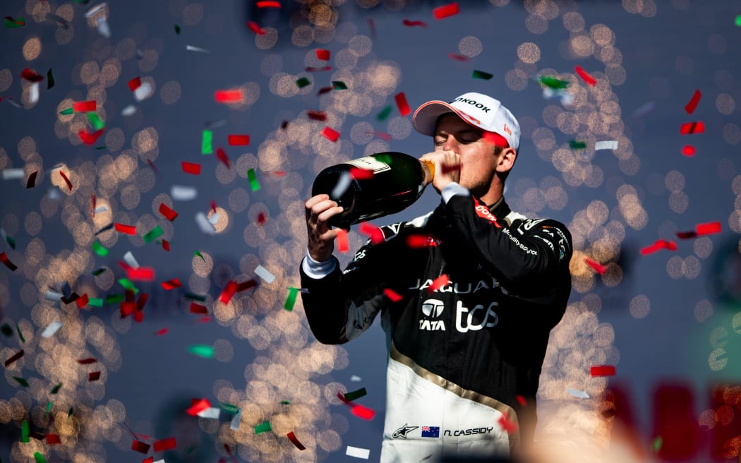 New Zealand driver Nick Cassidy celebrates at a Formula E race.