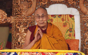 Tibetan spiritual leader Dalai Lama gestures a he leads a teachings gathering in Leh on July 28, 2022. (Photo by Mohd Arhaan ARCHER / AFP)