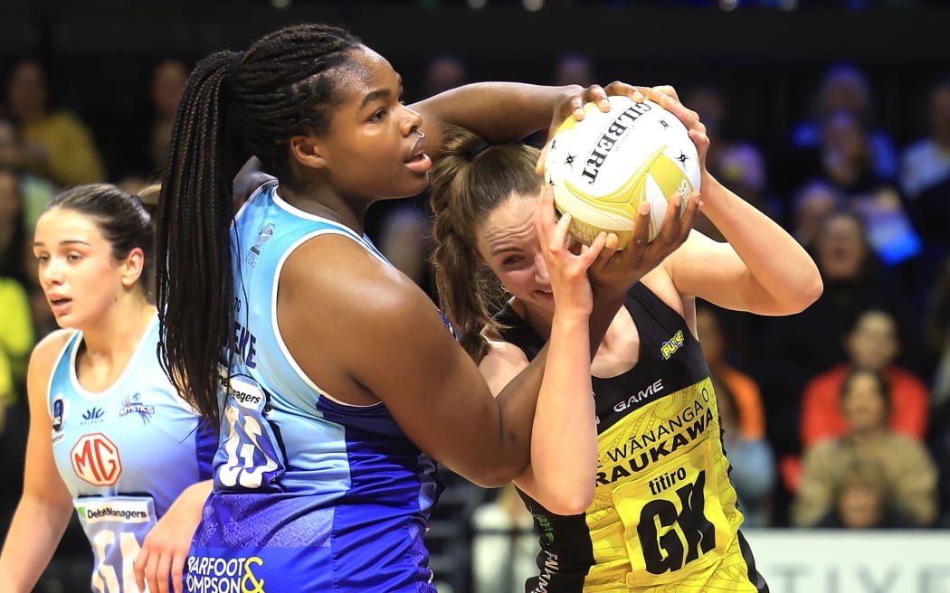 Mystics shooter Grace Nweke, left, tussles with Pulse captain Kelly Jackson during the 2024 ANZ Premiership Grand Final at TSB Arena, Wellington.